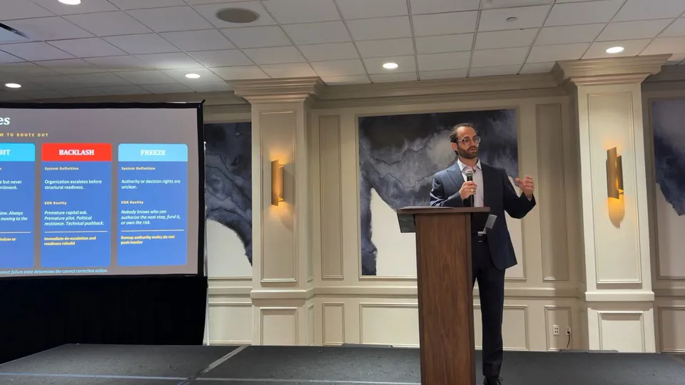 Arye Fisch presenting decision-intelligence work
